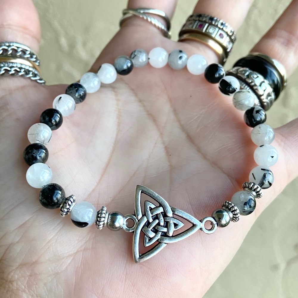 Celtic knot bracelet . Black & white rutilated quartz celtic charm bead bracelet